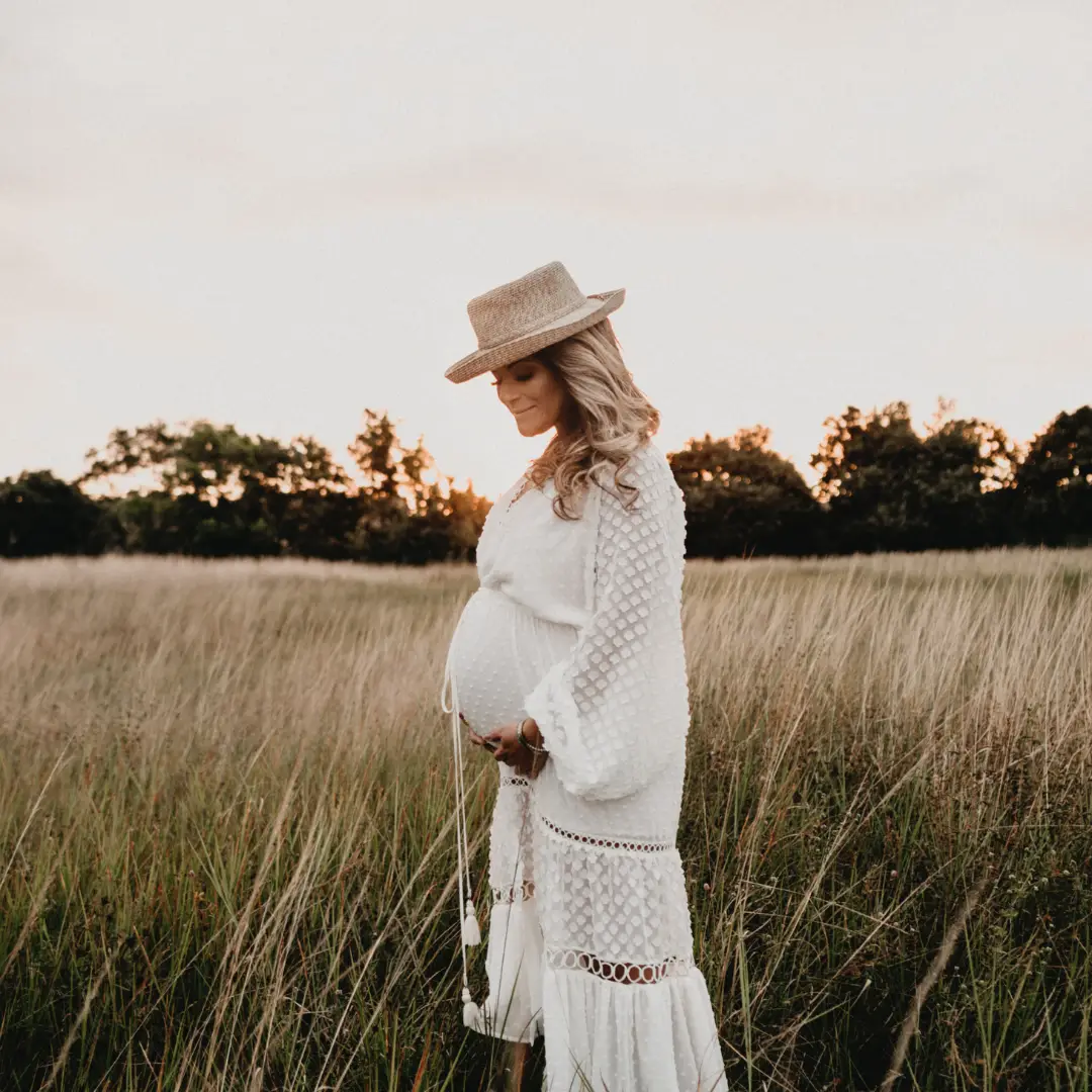 Expectant mother embracing pregnancy in nature - Serene Births private birth classes Perth