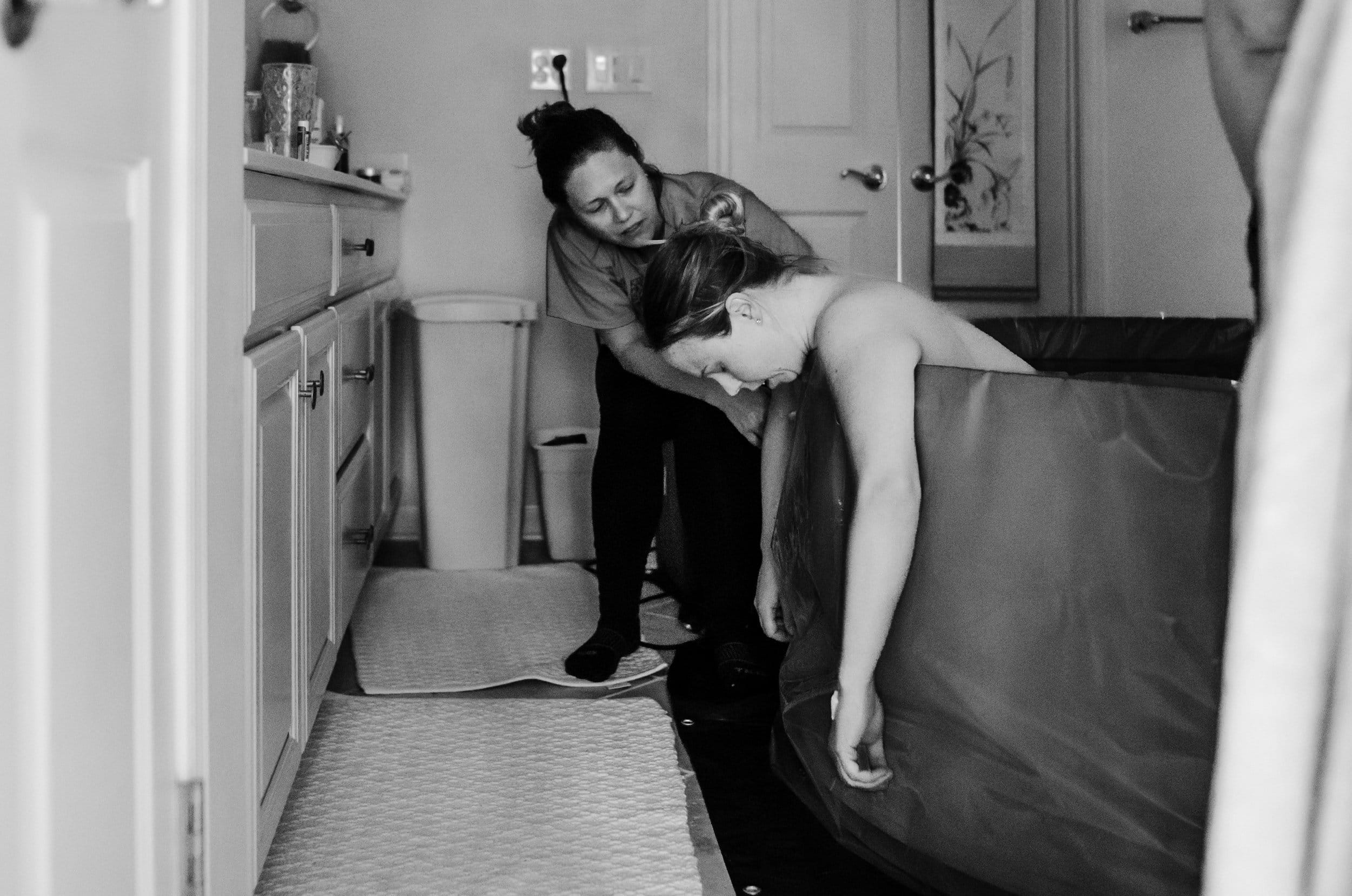 Doula providing continuous care during birth